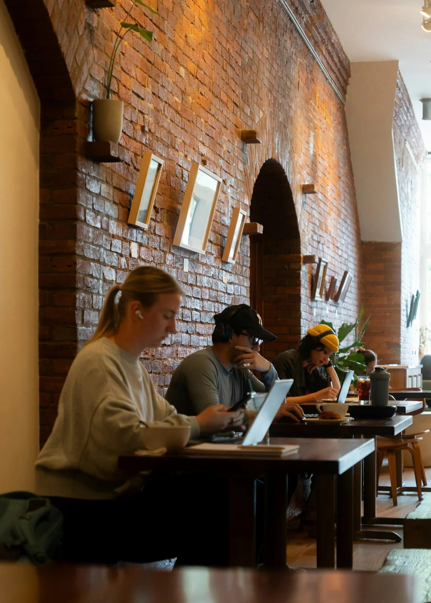 People working at laptops in a café